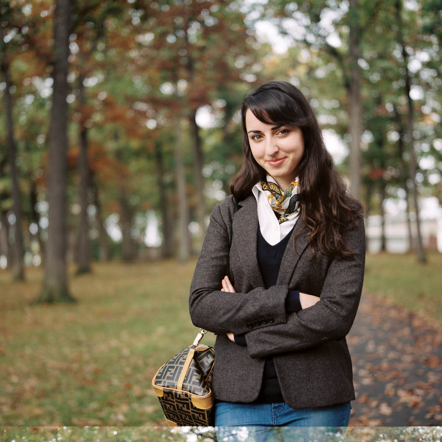 Photograph of a girl in recreation park in autumn