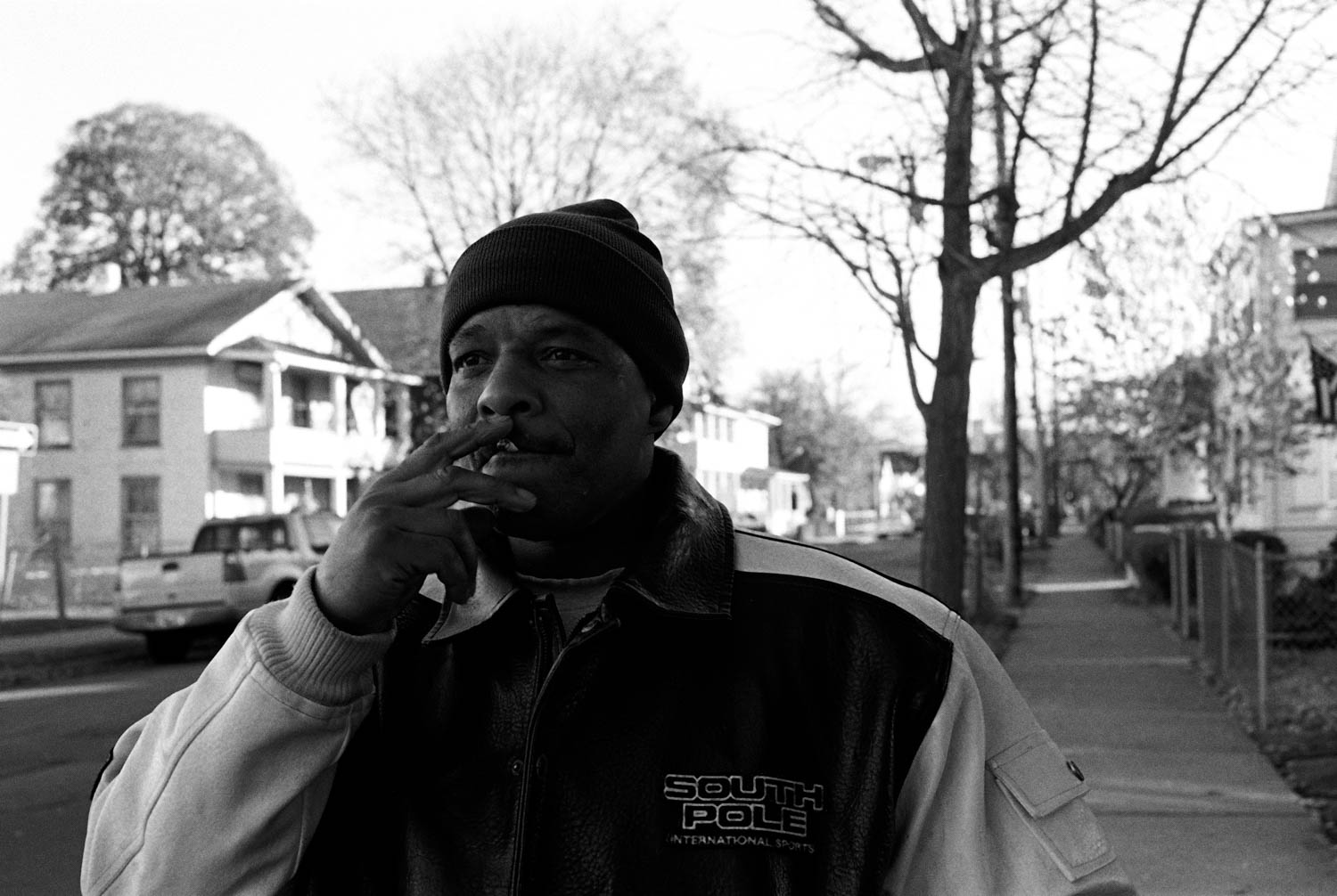 A street portrait of a man smoking a cigarette on Pine Street in Binghamton, New York.