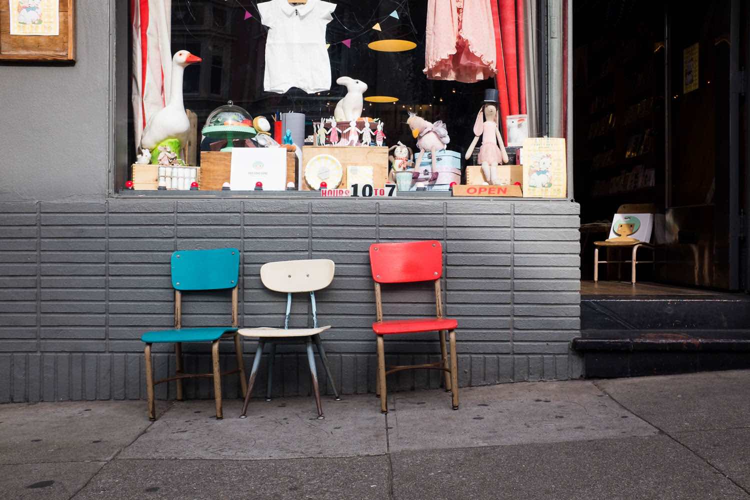 Colorful chairs arranged outside a San Francisco shop.